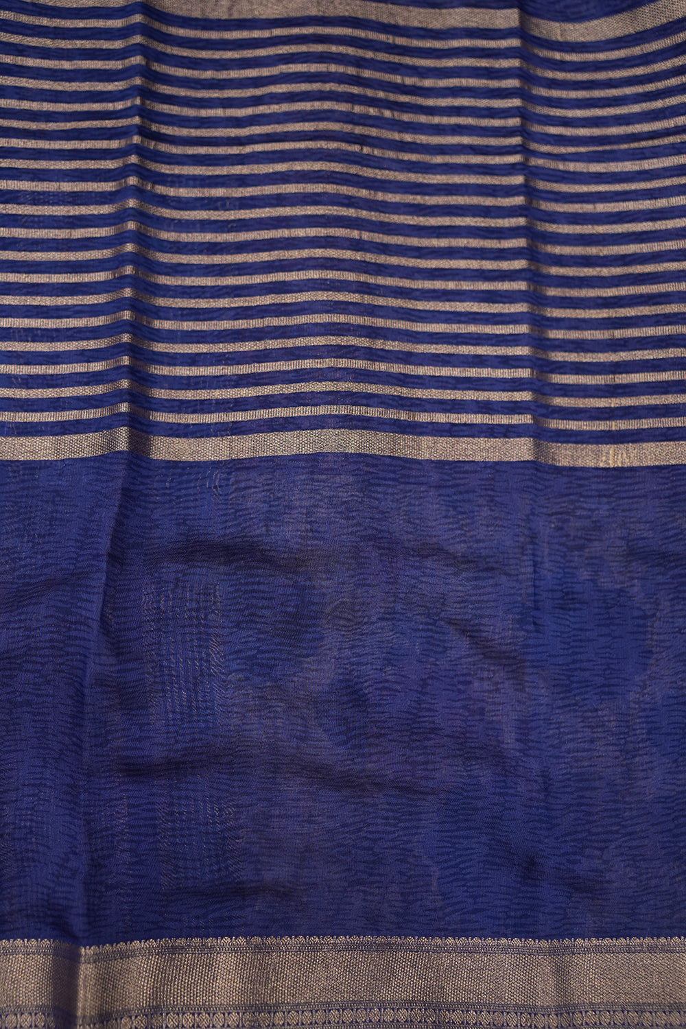 Blue Chanderi Tussar saree with a contrasting purple border and soft zari detailing, offering a lightweight and elegant drape.