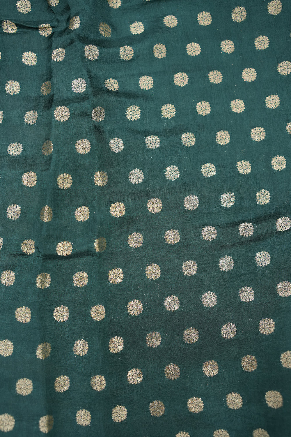 Vibrant Dola silk saree featuring intricate traditional motifs and a rich, elegant drape perfect for festive and cultural occasions.