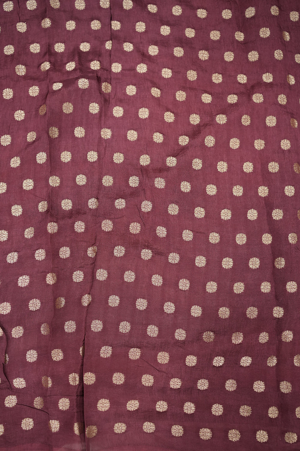 Orange chiffon Dola silk saree featuring a soft, flowy drape and subtle sheen, perfect for festive events and graceful occasions.