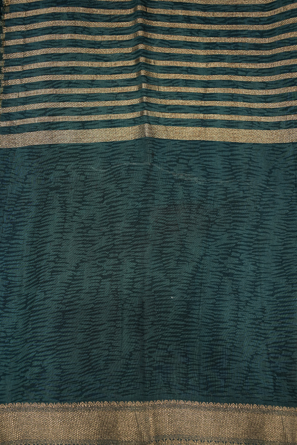 Green Chanderi Tussar saree with subtle zari detailing and a soft, elegant drape, perfect for festive and semi-formal occasions.