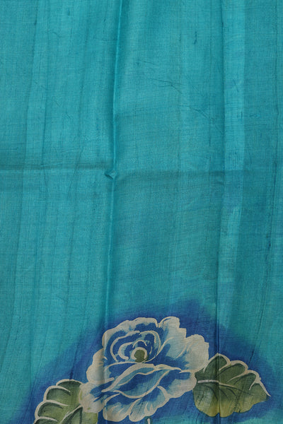 Aqua blue floral tussar saree.